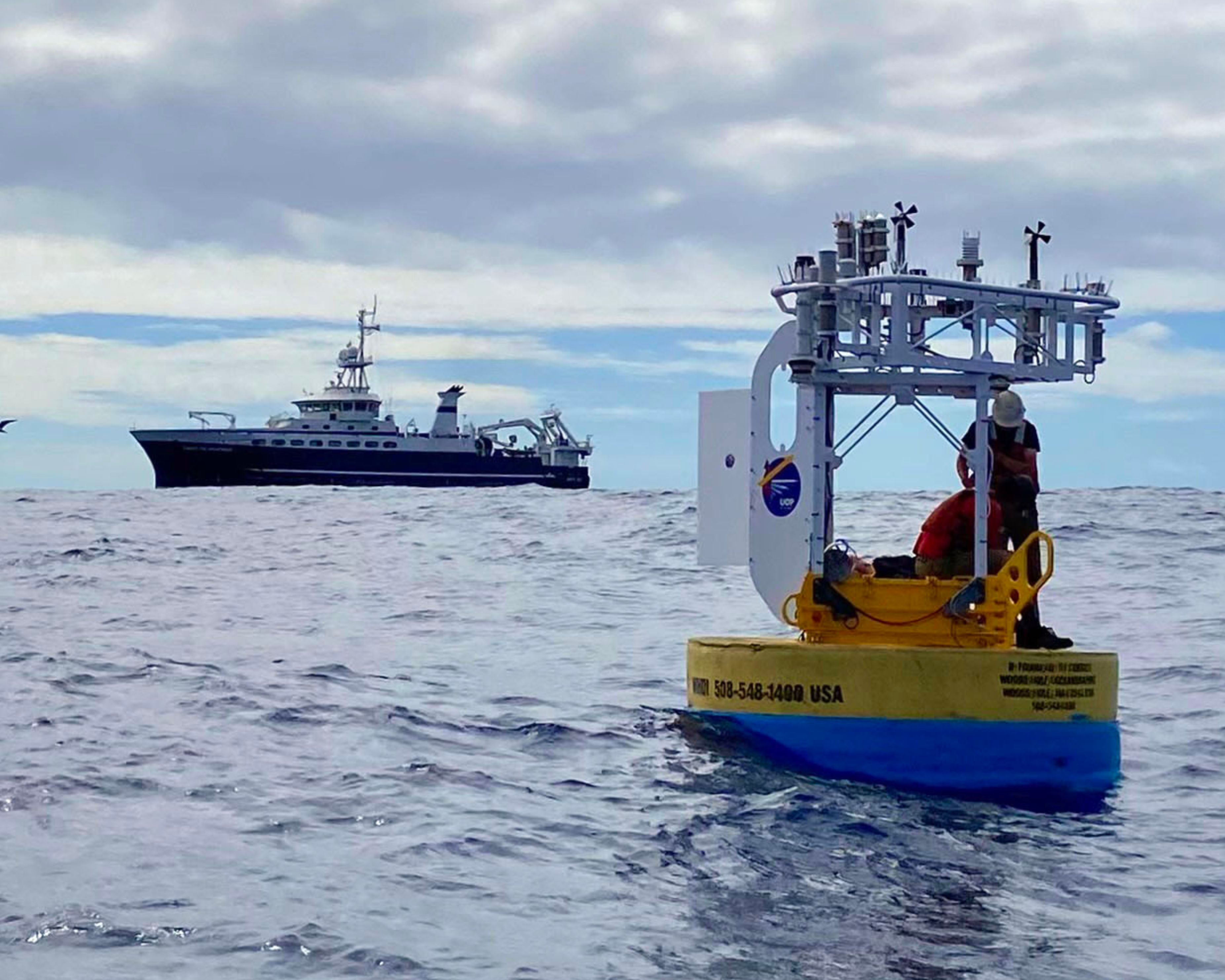 Ray Graham and Nathan Smith of WHOI service Stratus23 buoy on March 18 2025